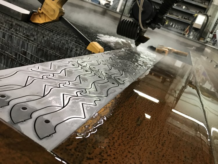 waterjet cutter cutting a sheet of metal shear blades-v2.JPG