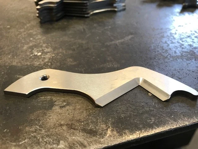 one shear blade laying flat on a metal table.JPG