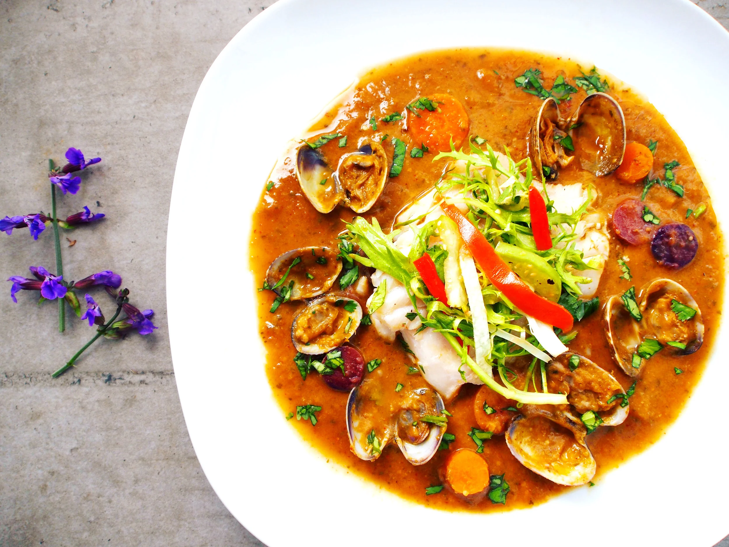 The best recipe for grilled red snapper in a tomatillo sauce. The sauce is more of a broth and really marries the flavor of the snapper and the clams together. This is a healthy fish recipe that is elegant to make. It's a fancy fish recipe that would impress your friends for sure!
