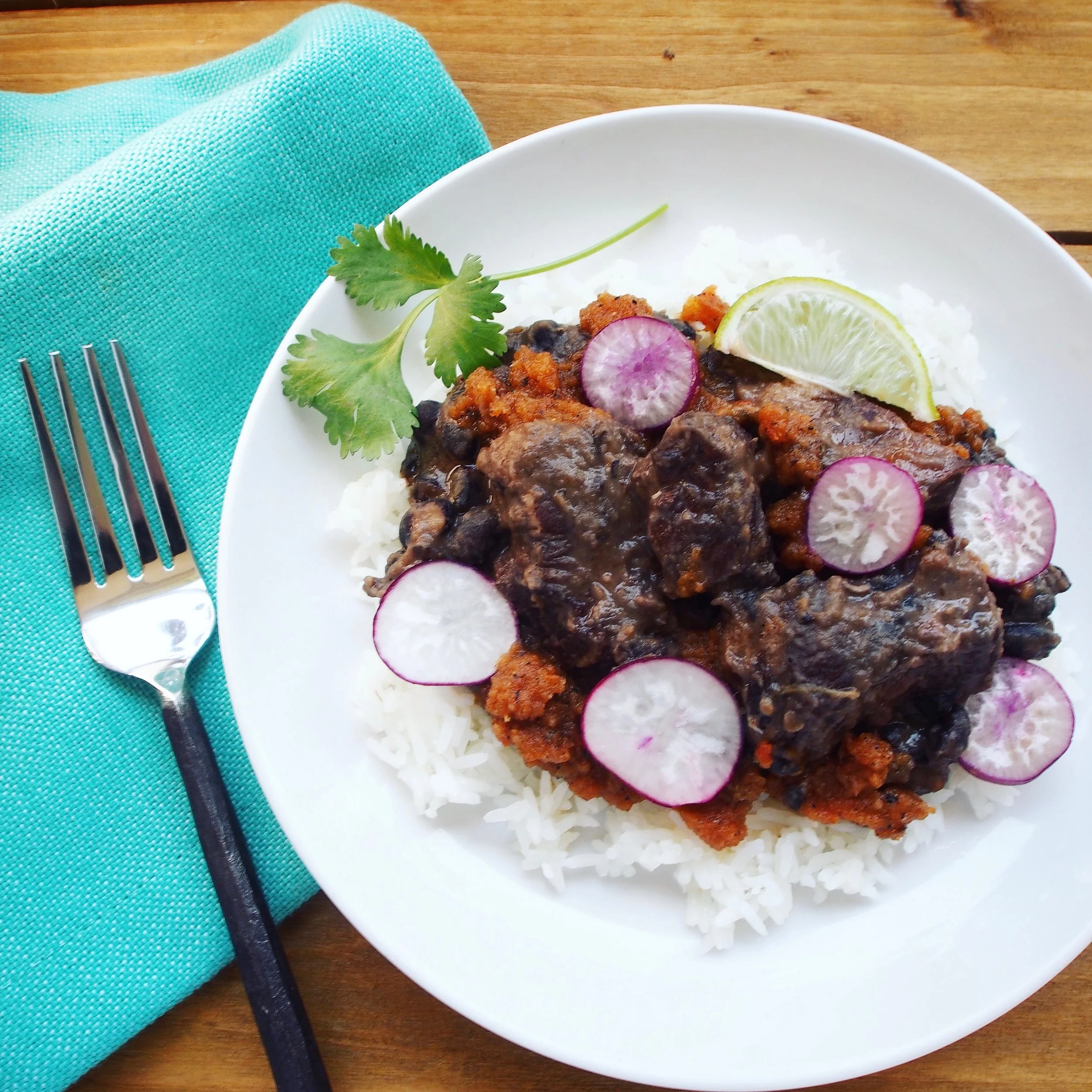Fijol con Puerco is a Pork Black and Bean Stew. This Mexican Stew is spicy with habanero powder and jalapenos. It uses spiceology’s sweet and spicy habanero rub. The slow-cooked pork and beans are done in about 90 minutes.