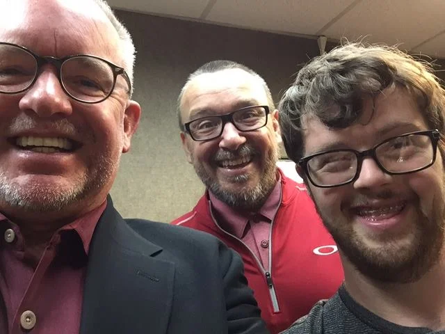  Robert, Tracy, and Trevor posing for a photo after an interview on Orange Voice Radio.