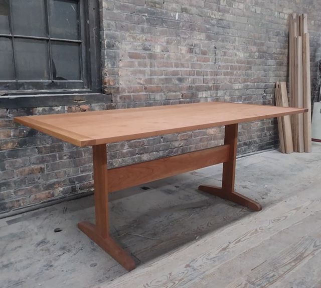 Cherry dining table available for purchase.