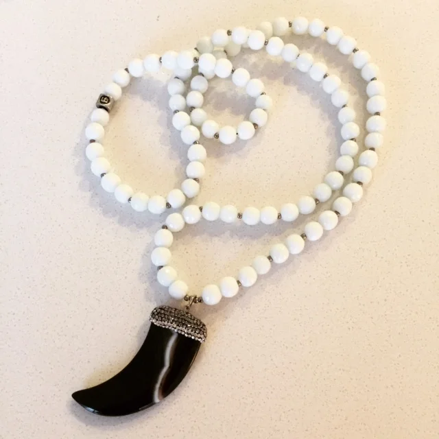 Rock & Lulu white bead and horn.JPG