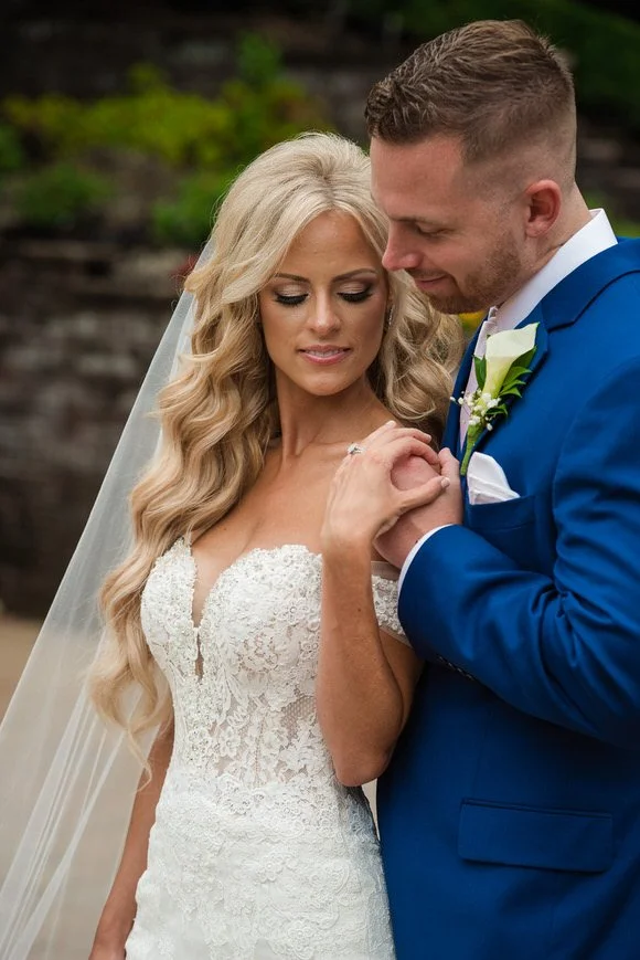 Bride and groom portraits surrounded by greenery in New Jersey