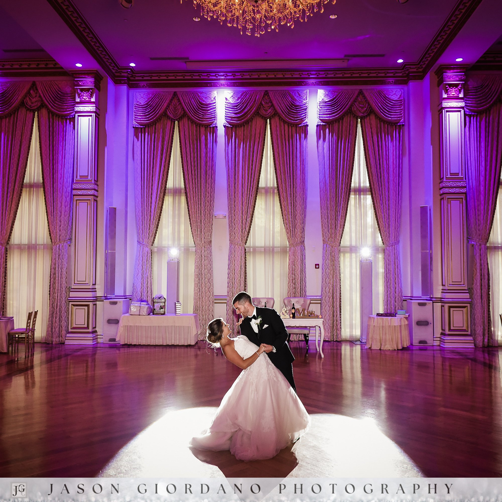 Bride and groom sharing a romantic dance in the formal ballroom at The Tides estate wedding venue