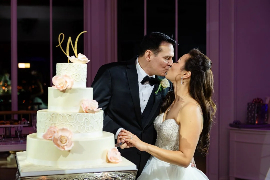 Bride and groom cutting their wedding cake during the reception at Westmount Country Club.