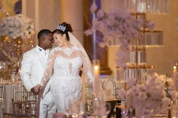 Bride and groom portrait during the reception at The Venetian in Garfield, NJ, surrounded by elegant floral décor.