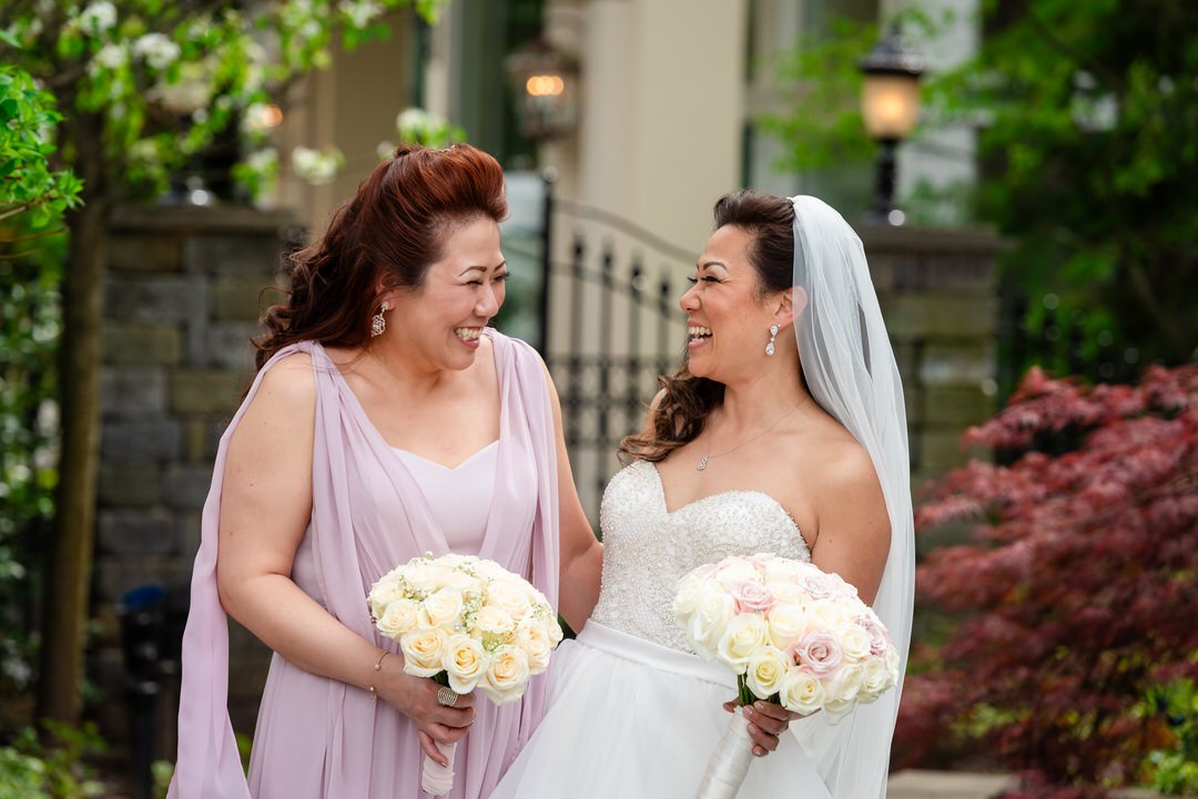 Bride sharing a sweet moment with her mother before the ceremony at Westmount Country Club.