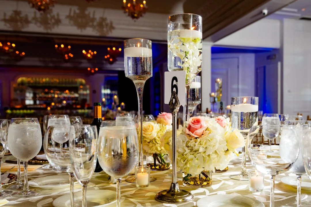 Gold and candlelit wedding reception centerpieces at Westmount Country Club.