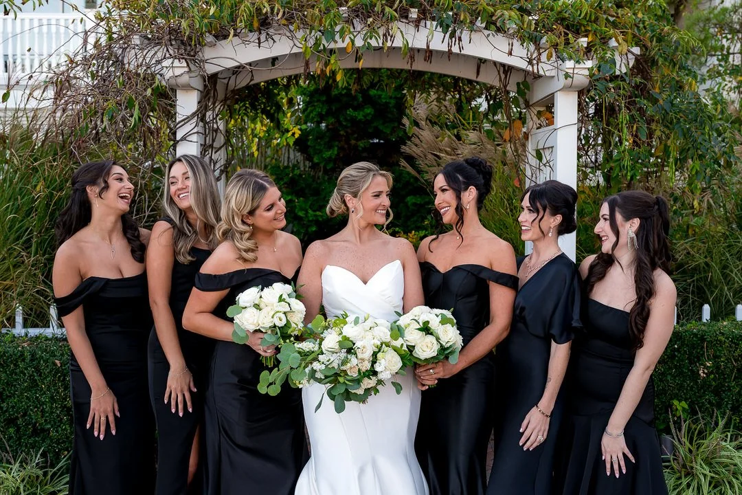 Bridesmaids celebrating together during a Mallard Island Yacht Club wedding reception