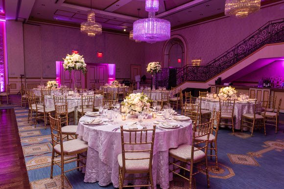 Elegant candlelit table centerpieces during an Essex County wedding reception