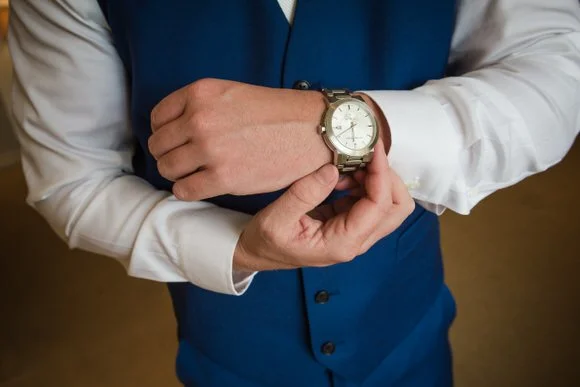 Groom checking his watch before his Essex County NJ wedding ceremony