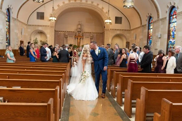 Bride and groom walking back up the aisle after exchanging vows