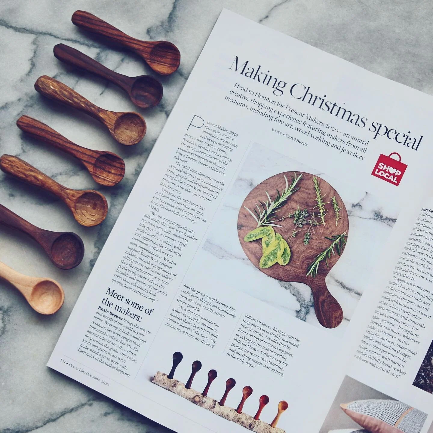A photo of a board on a marble tabletop in a magazine on the same marble tabletop. That&rsquo;s a bit meta. Thanks @devonlifemag for the feature highlighting artists currently showing at the Christmas Exhibition- Present Makers @thelmahulbertgallery