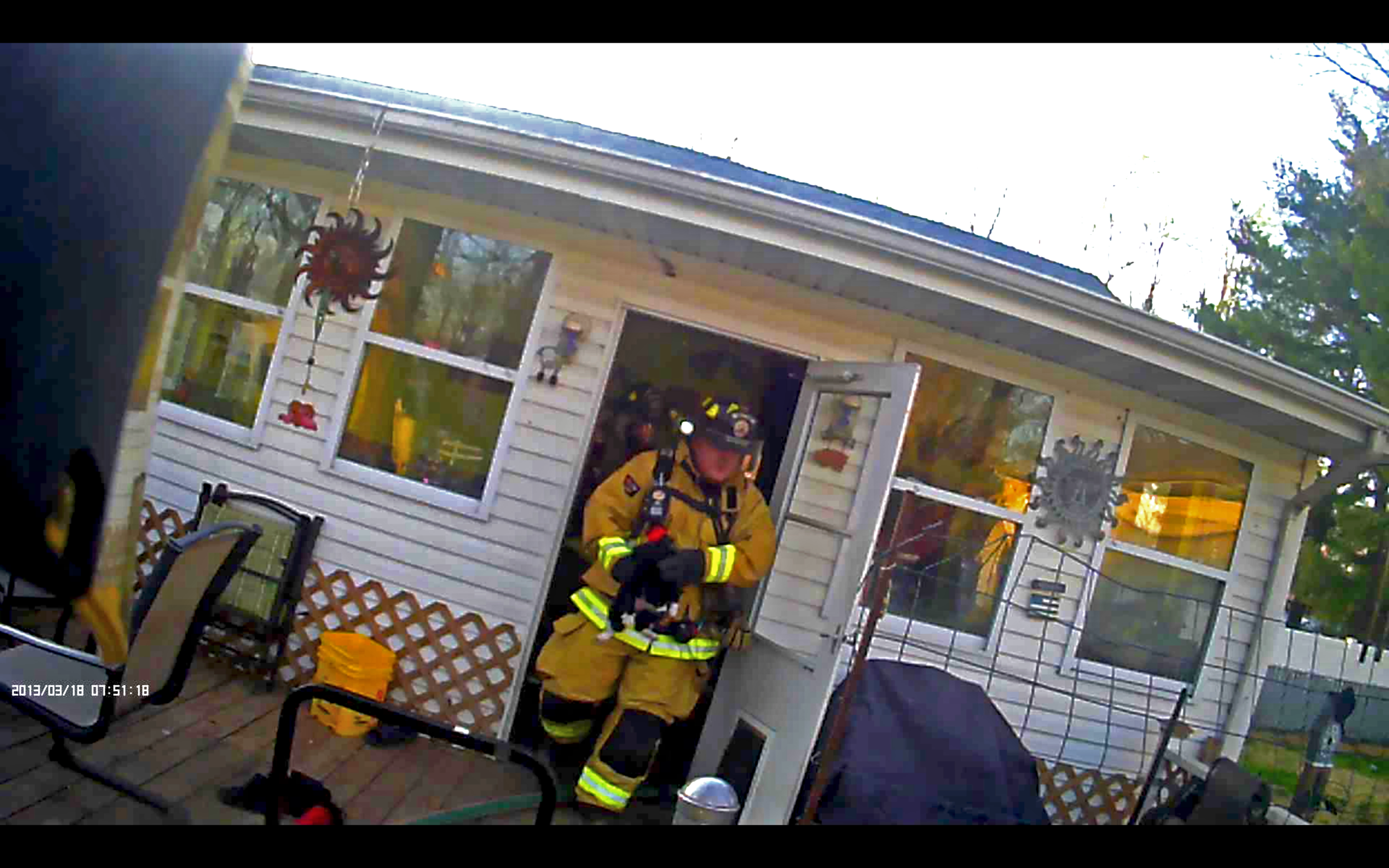  On 3 April 2016, ESFD responded to a report of a structure fire. Pictured is Firefighter Stock rescuing a pet from the residence. Firefighters were able to extinguish the fire in its room of origin, saving the home from further damage. 