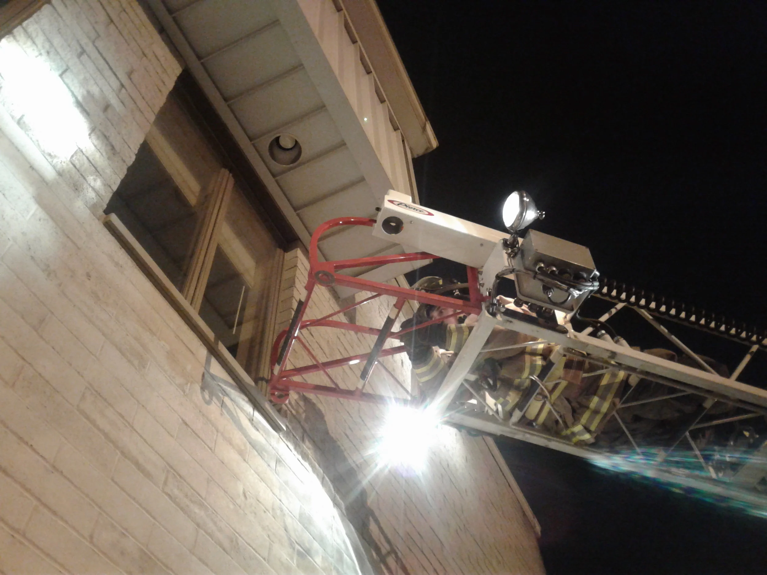 Firefighters practiced apparatus placement and deploying the aerial ladder.