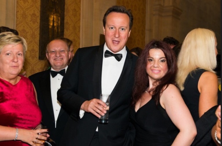 At a Conservative black-tie fundraiser with the then Prime Minister David Cameron ( 2014)