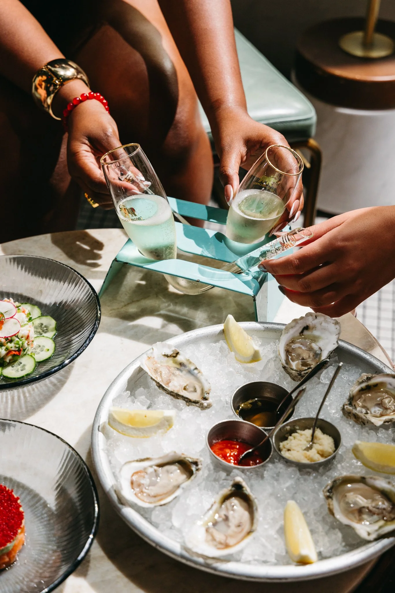 Oysters and champagne Marsh House Nashville Happy Hour