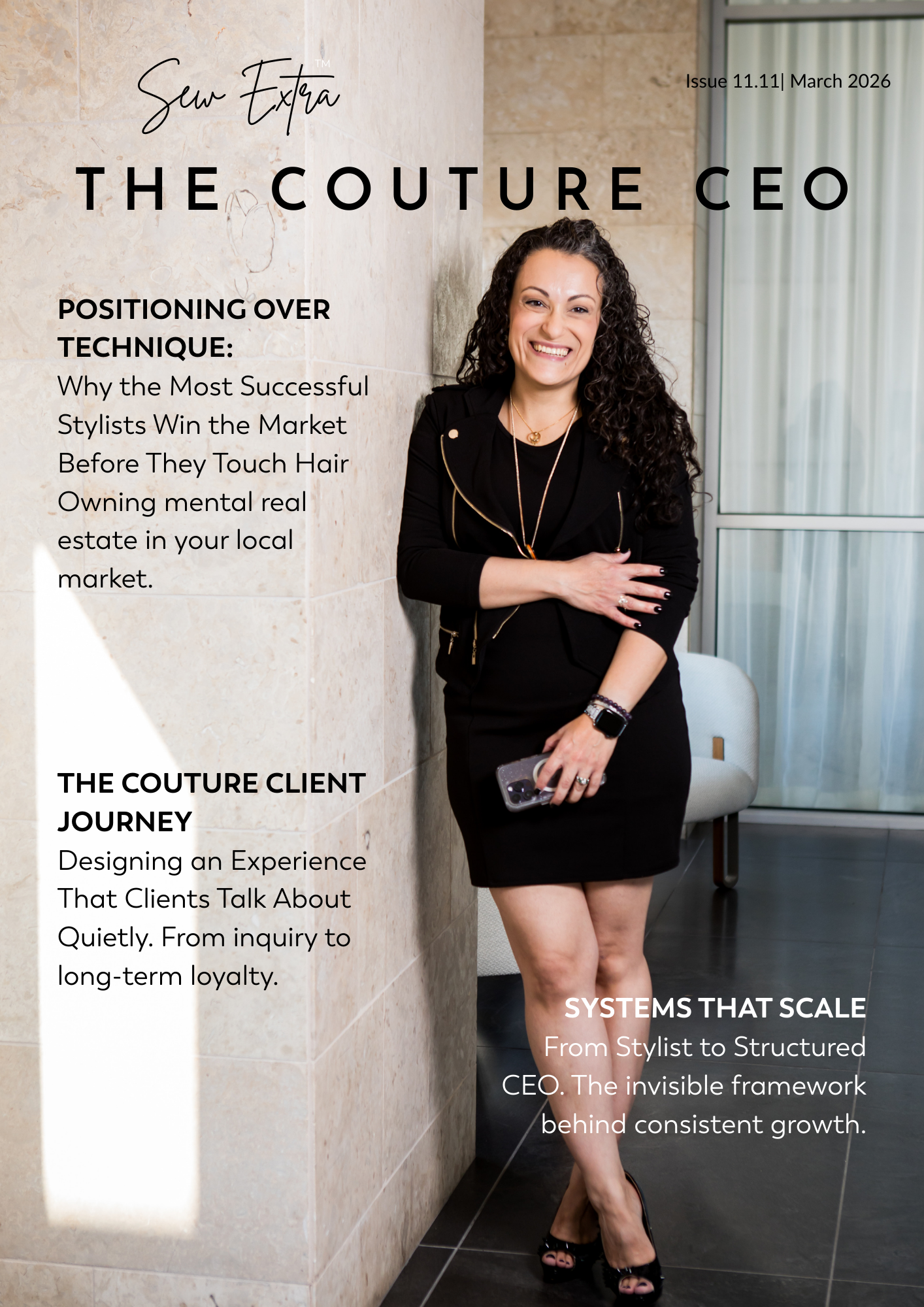 A woman with curly dark hair standing against a beige tiled wall, smiling, wearing a black dress and black heels, holding a phone, with magazine text overlayed on the image.