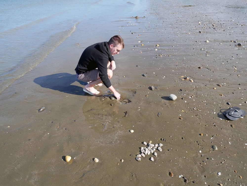  Trey digs for dinner, not hard when the beach is exposed during low tide. &nbsp; 