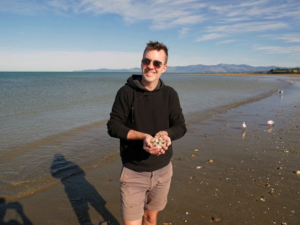  Trey shows off our dinner finds from the shoreline of Parapara Beach (Golden Bay; Jan 13).&nbsp; 