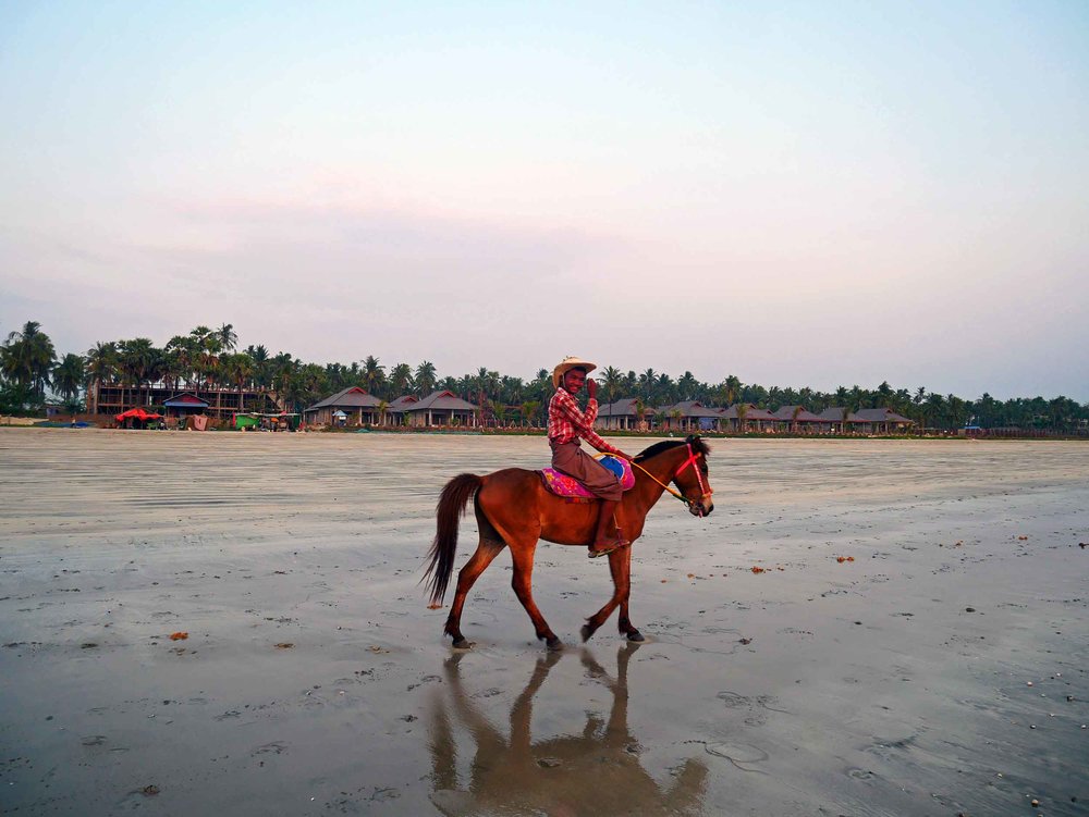  Young men on horseback gallop along the beach from point to point, often showing off for photos.&nbsp; 