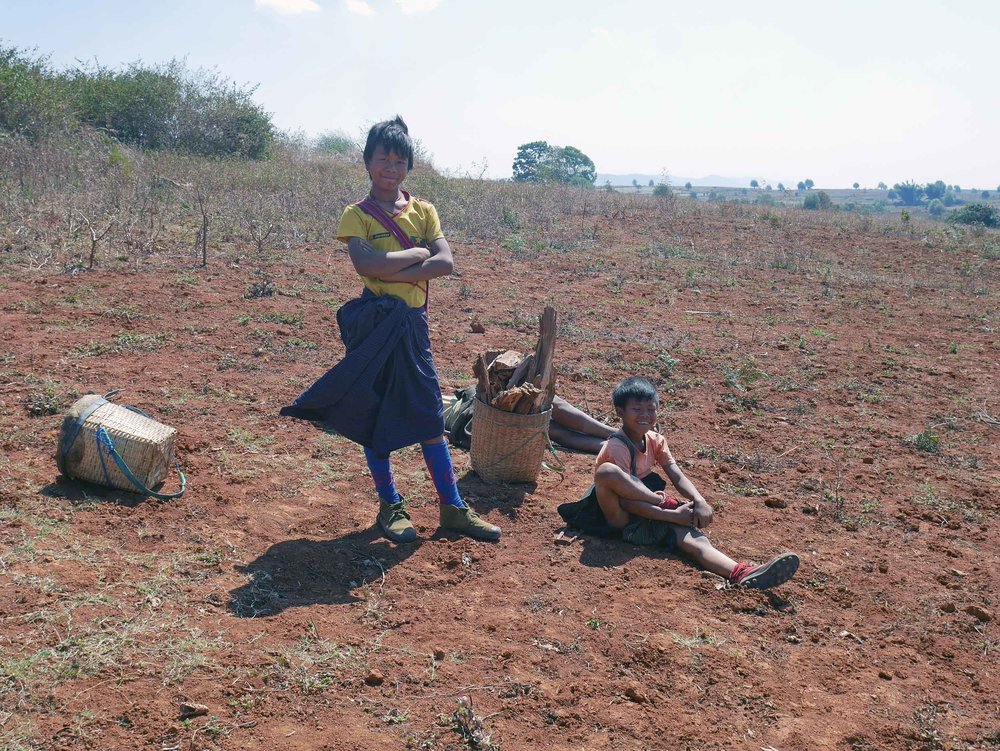  Children take a rest with their father after chopping firewood (Feb 20).&nbsp; 