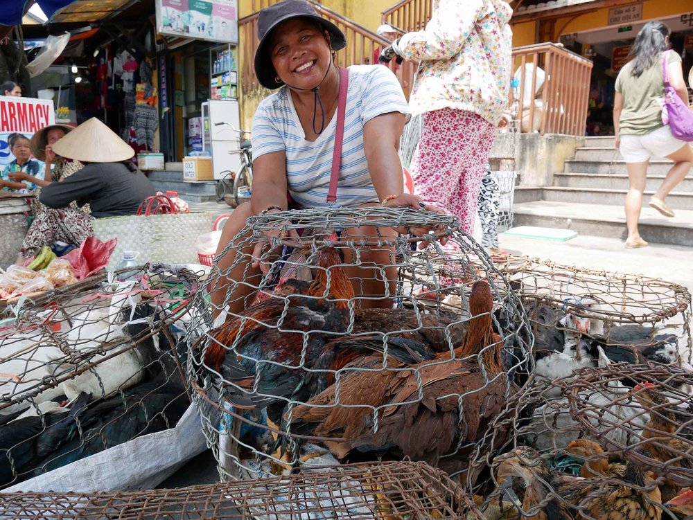  Martin loved the local market, with its bustling activity and live animals. We had to pull him away from this smiling poultry peddler!&nbsp; 