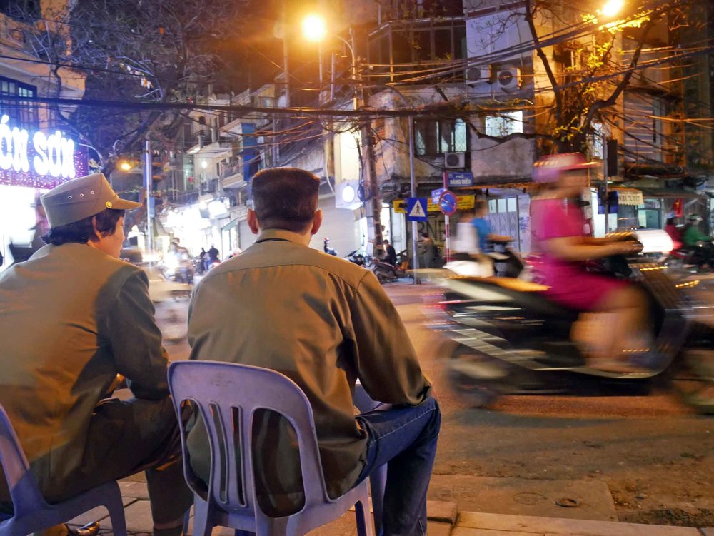  While we sipped our tea, these gentlemen swept off the curb and then brought over their own table and chairs to sit down in front of us.&nbsp; 