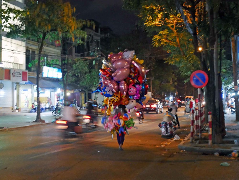  Like in Saigon, anything can be carried on or sold from a motorbike.... balloons!&nbsp; 
