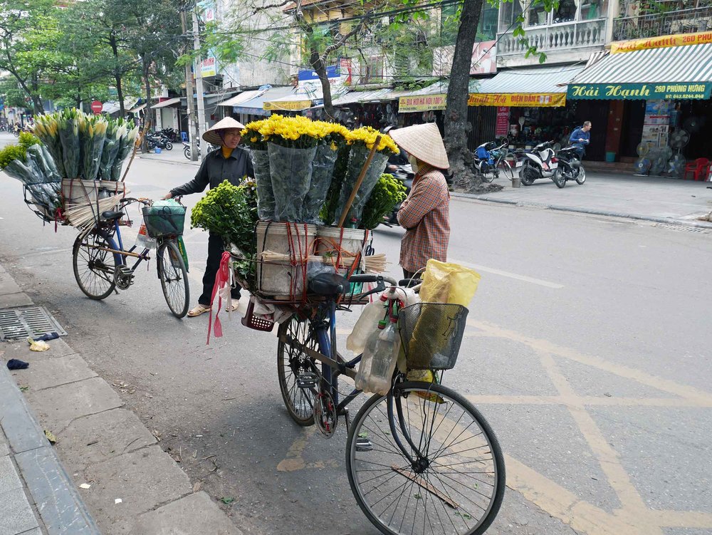  Or here, we saw ladies selling flowers from their bicycles.&nbsp; 