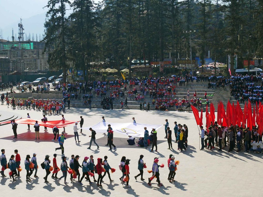  Olympic honorary flag procession ceremony of Vietnamese youth in Sapa town square (interestingly this was one of two Olympic ceremonies we witnessed while in Vietnam - last year Vietnam one its first gold medal -ever- in Rio!) (Mar 22).    