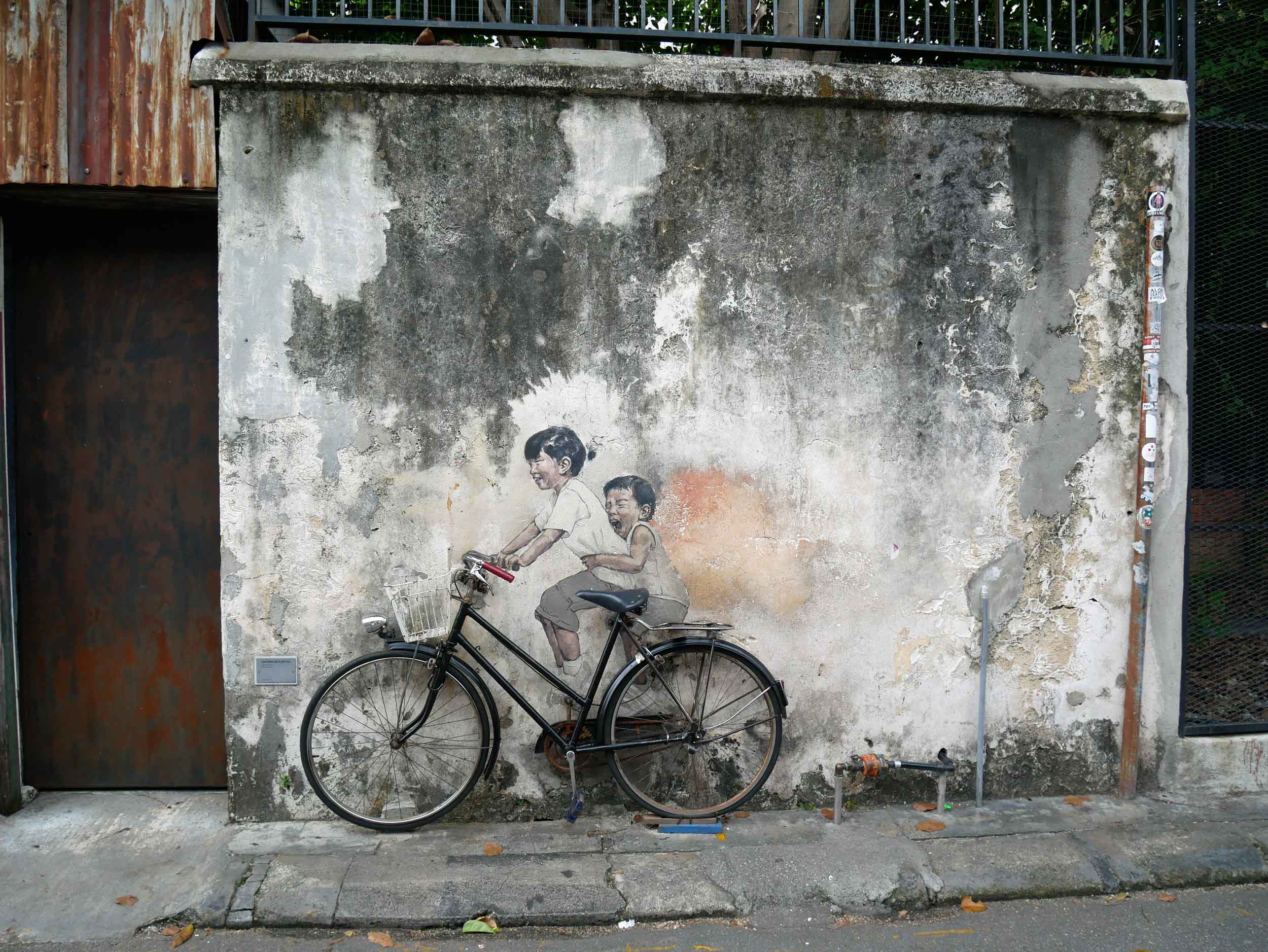  One of the more famous works by Lithuanian artist Ernest Zacharevic,  Children on Bicycle .&nbsp; 
