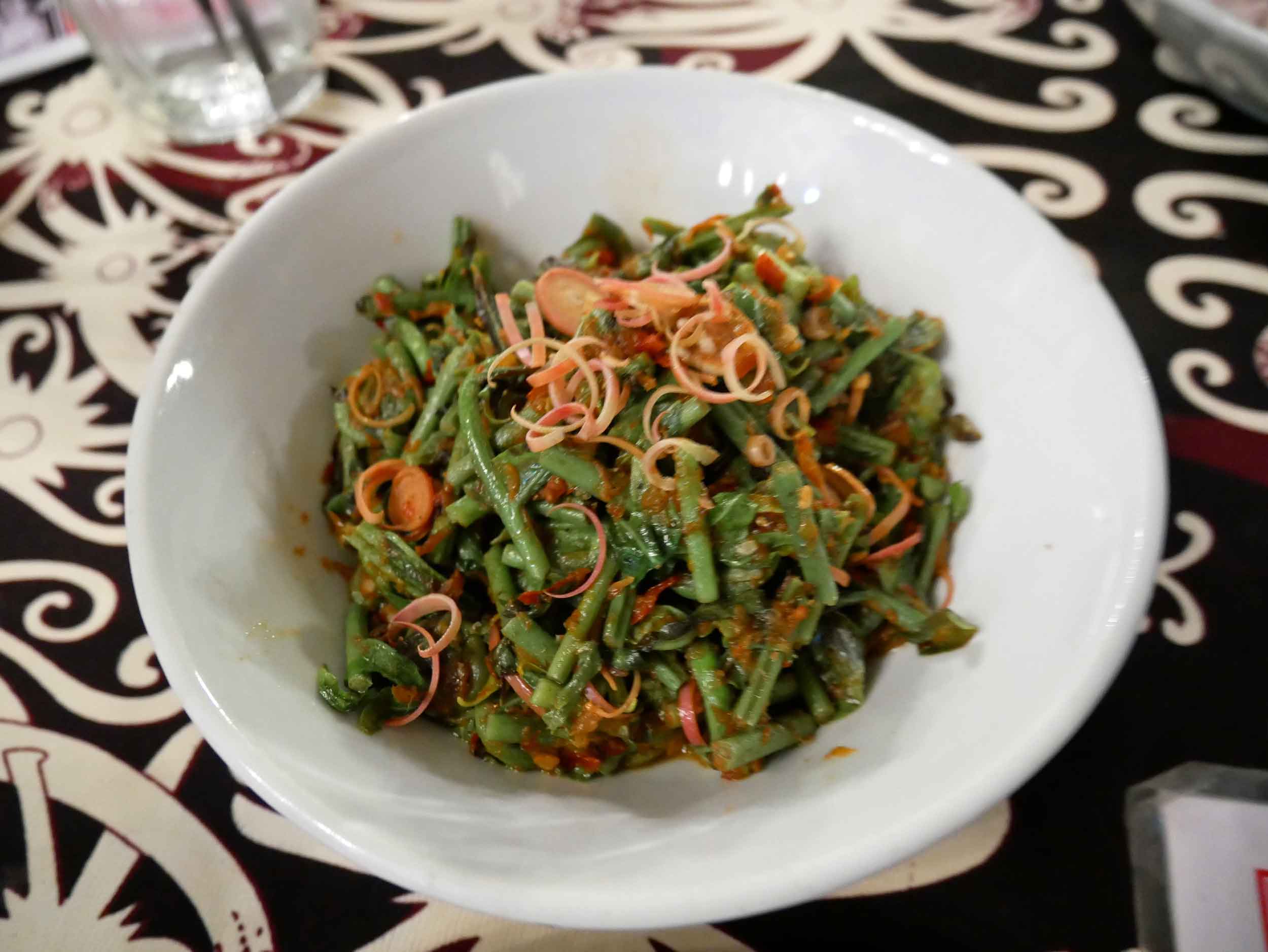  Spicy and bitter, the  stir fried fiddlehead ferns &nbsp;at The Dyak were a Malay take on the now trendy dish.&nbsp; 