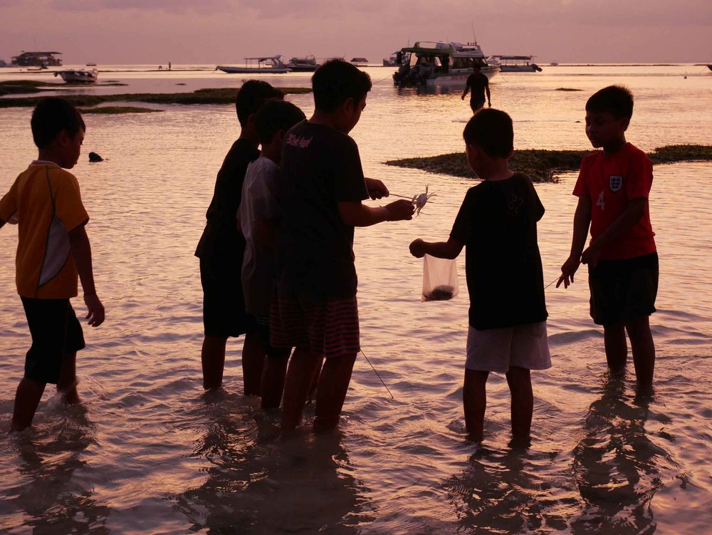  Young Balinese children playing and hunting for fish as we docked at sunset near Nusa Lembongan, Bali (May 14). 