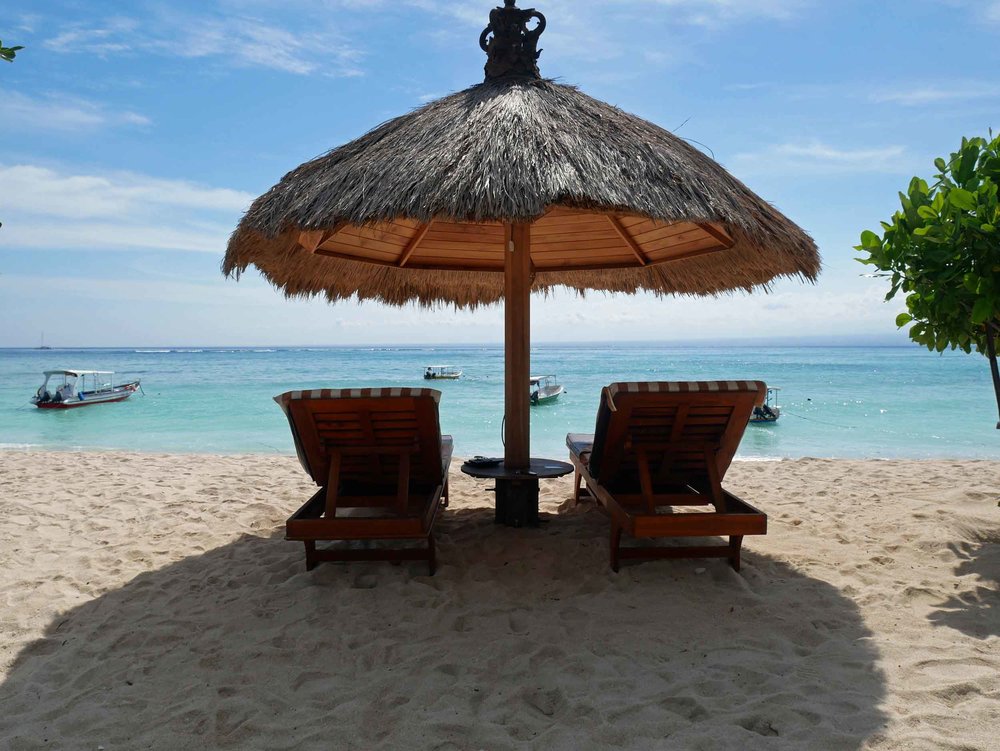  We planted ourselves under this straw umbrella on Lembongan’s Pemedal Beach. 