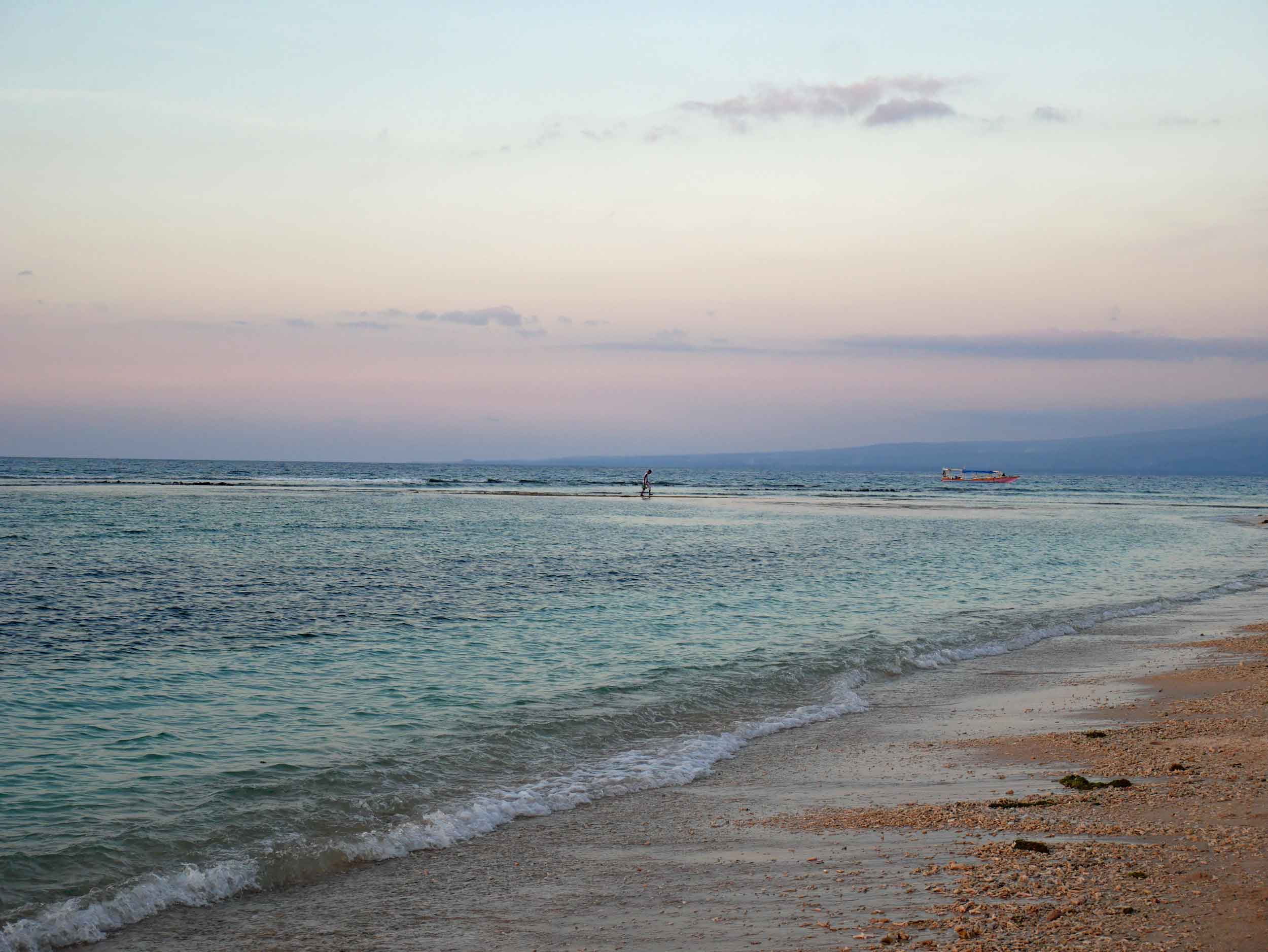  Sunset from the Gili Air coast, where a fisherman was taking advantage of the low tide to seemingly walk on water. 