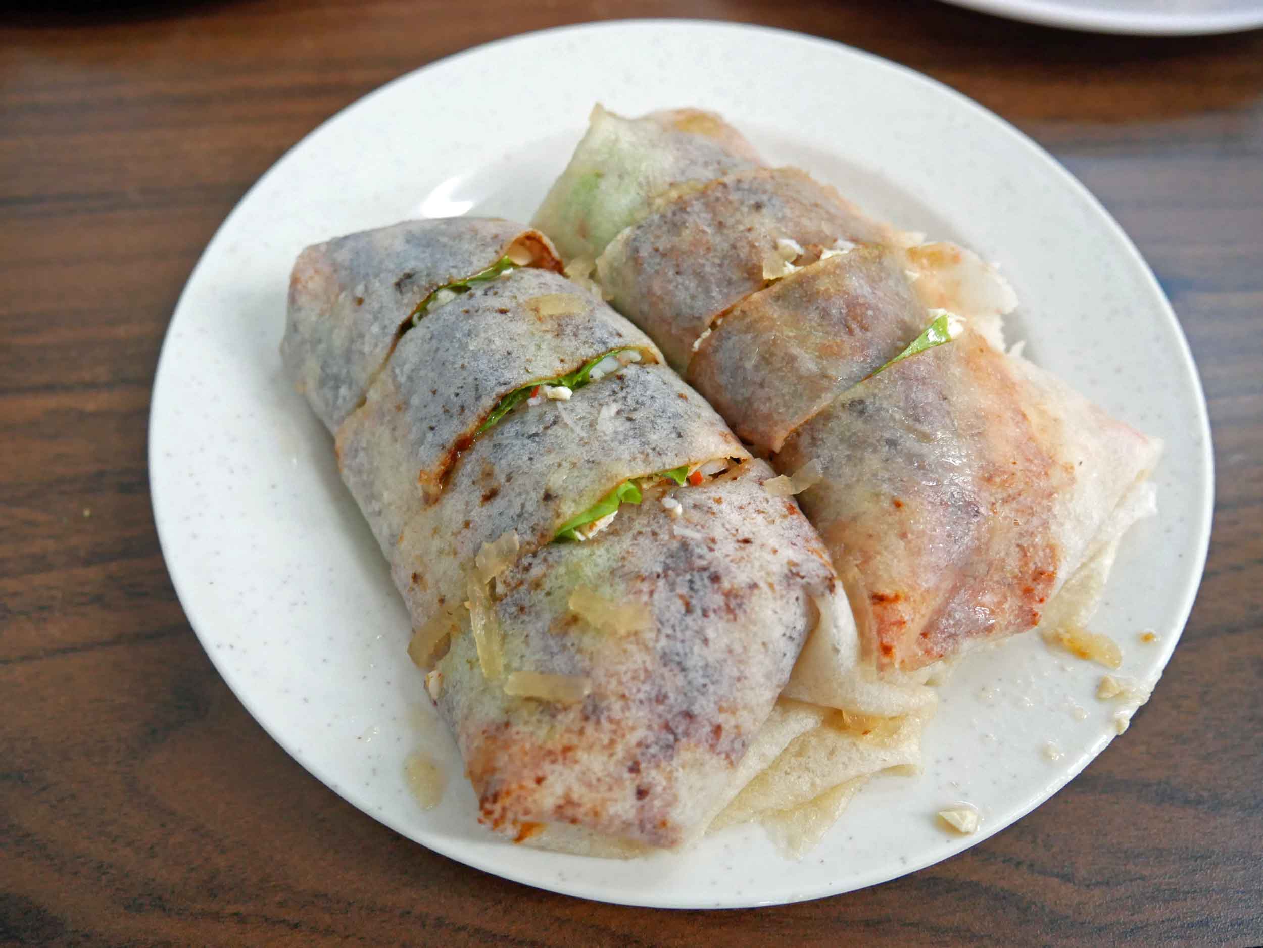  One of the local specialties was  seafood popiah , a thin crepe roll with a mix of crab, omelette and fried shallots inside.&nbsp; 