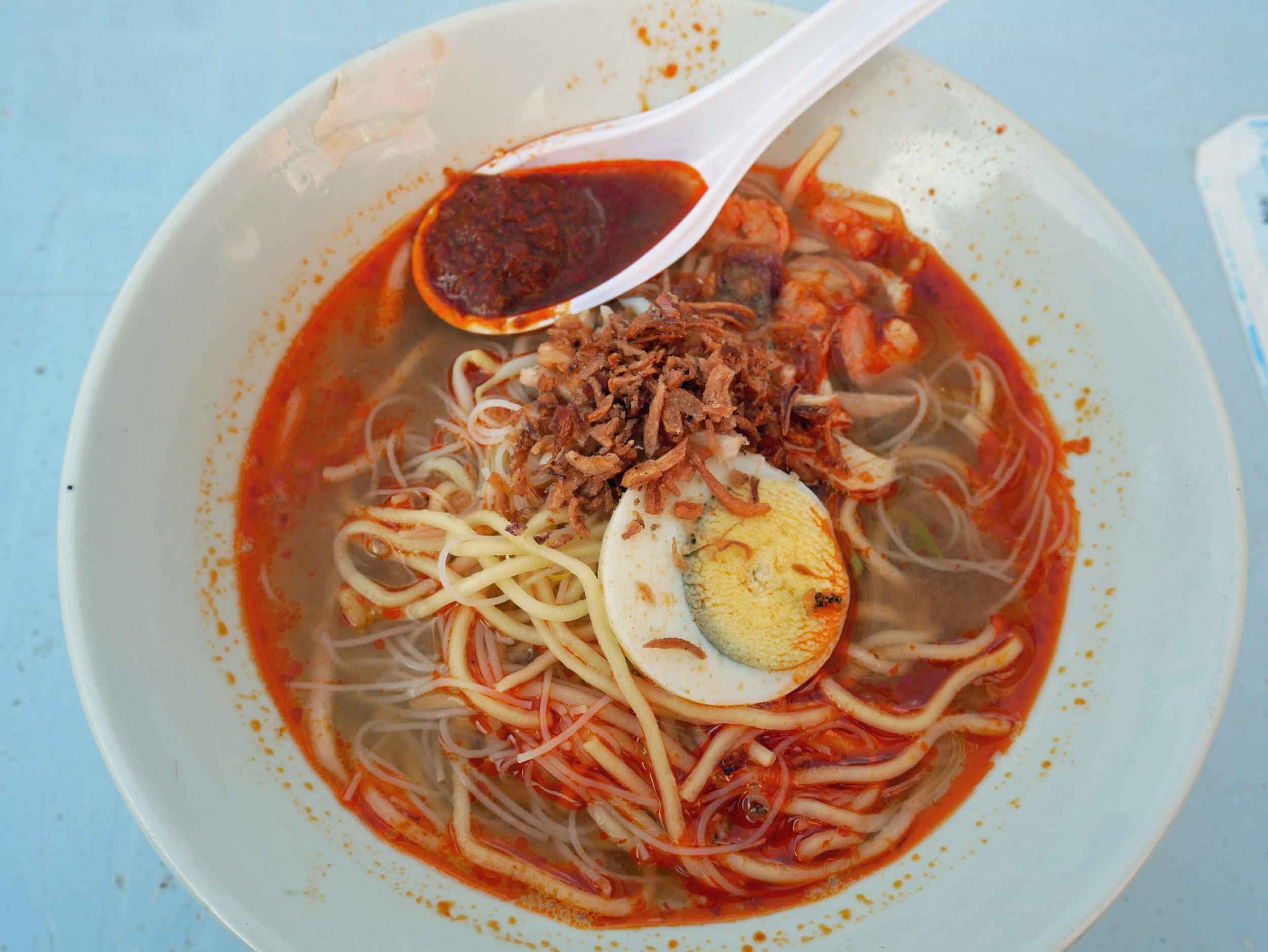  A favorite was a local version of hokkien mee, an fried egg and rice noodle dish in a spicy broth. &nbsp; 