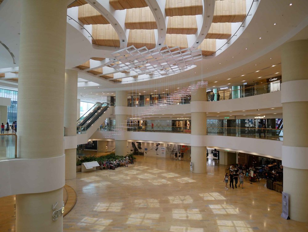  Because of the sticky heat of Hong Kong, many commutes around the city take travelers through air conditioned shopping malls and covered walkways. &nbsp; 