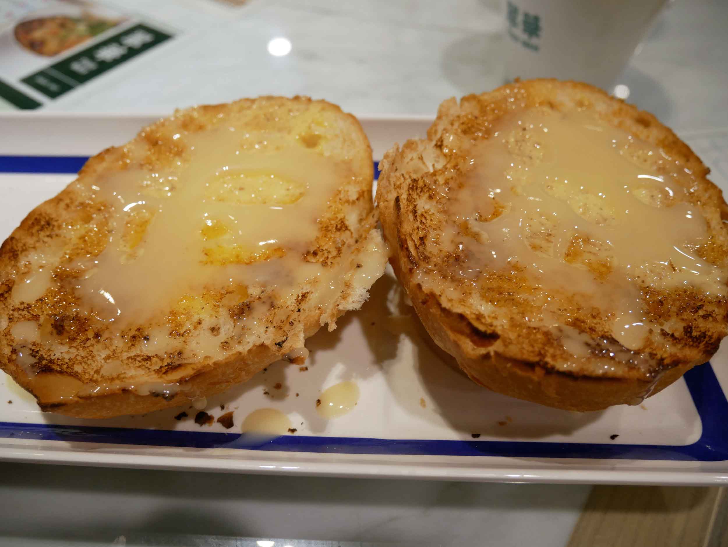  We started with  sweet bread , which is grilled toasted topped with sweetened condensed milk.&nbsp; 