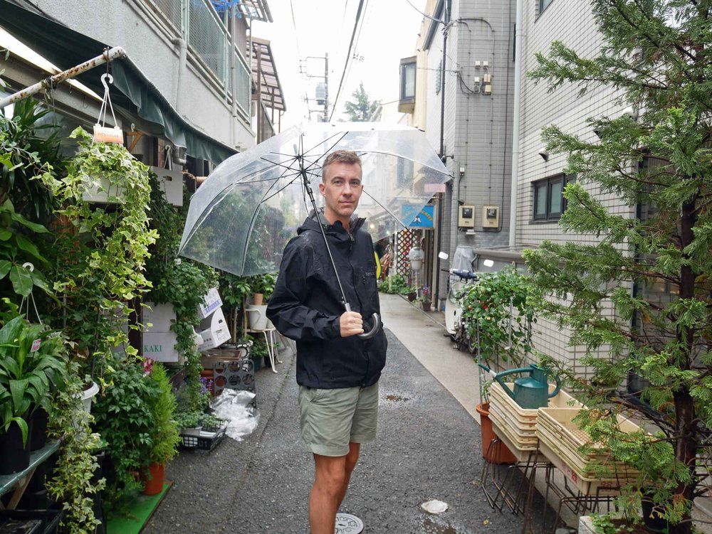  As the rain began to come down, clear umbrellas appeared all across town, so we had to get a pair ourselves!&nbsp; 