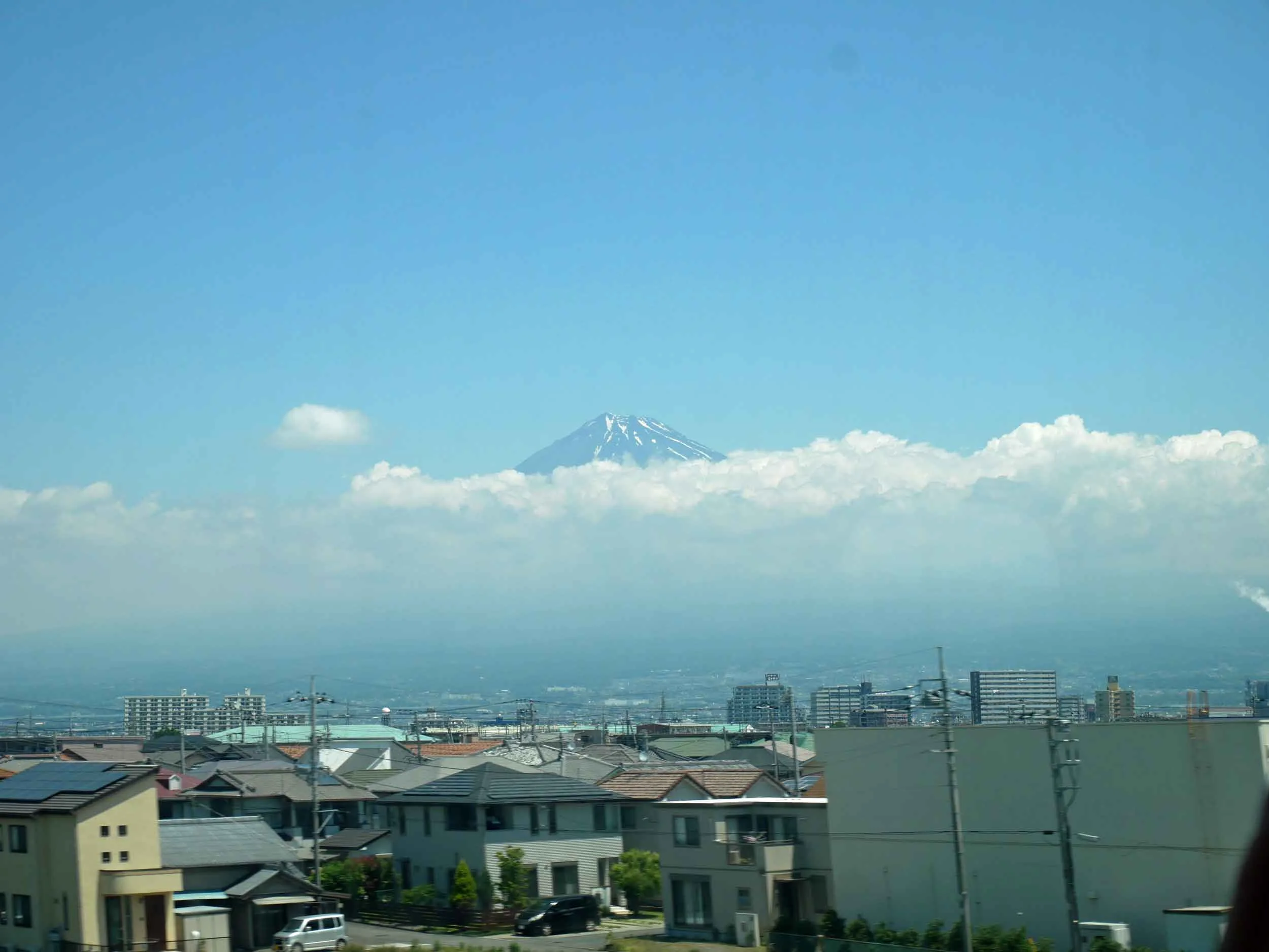  Rising above the clouds, we were in awe of the magnitude of Mt. Fuji speeding by at 250 KMpH.&nbsp; 