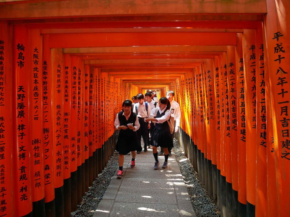 School kids running through the famed Inari gates and snapping pics as they go.&nbsp; 