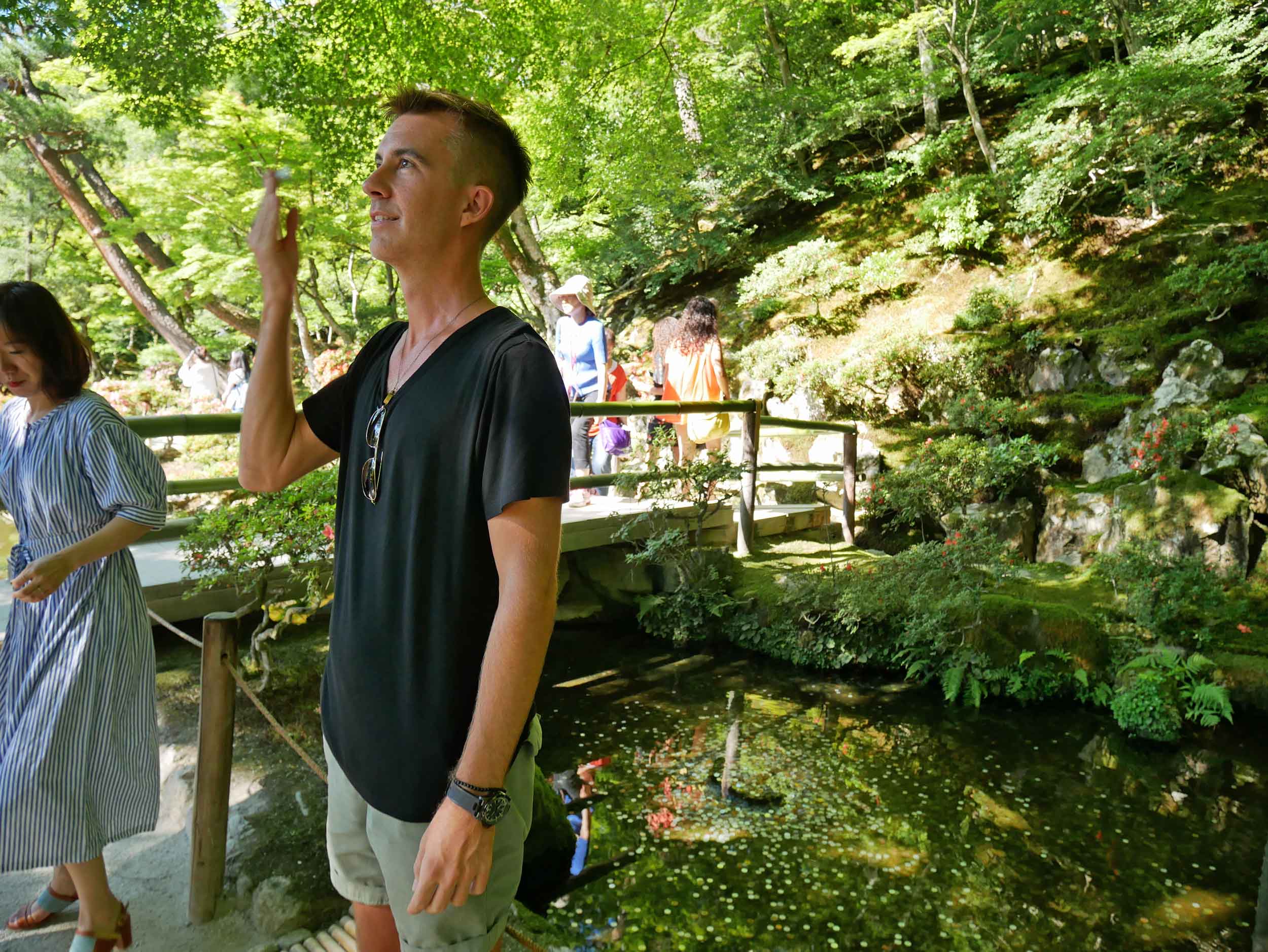 Trey making a wish with the toss of a coin into a pond in Ginkaku-ju temple complex. 