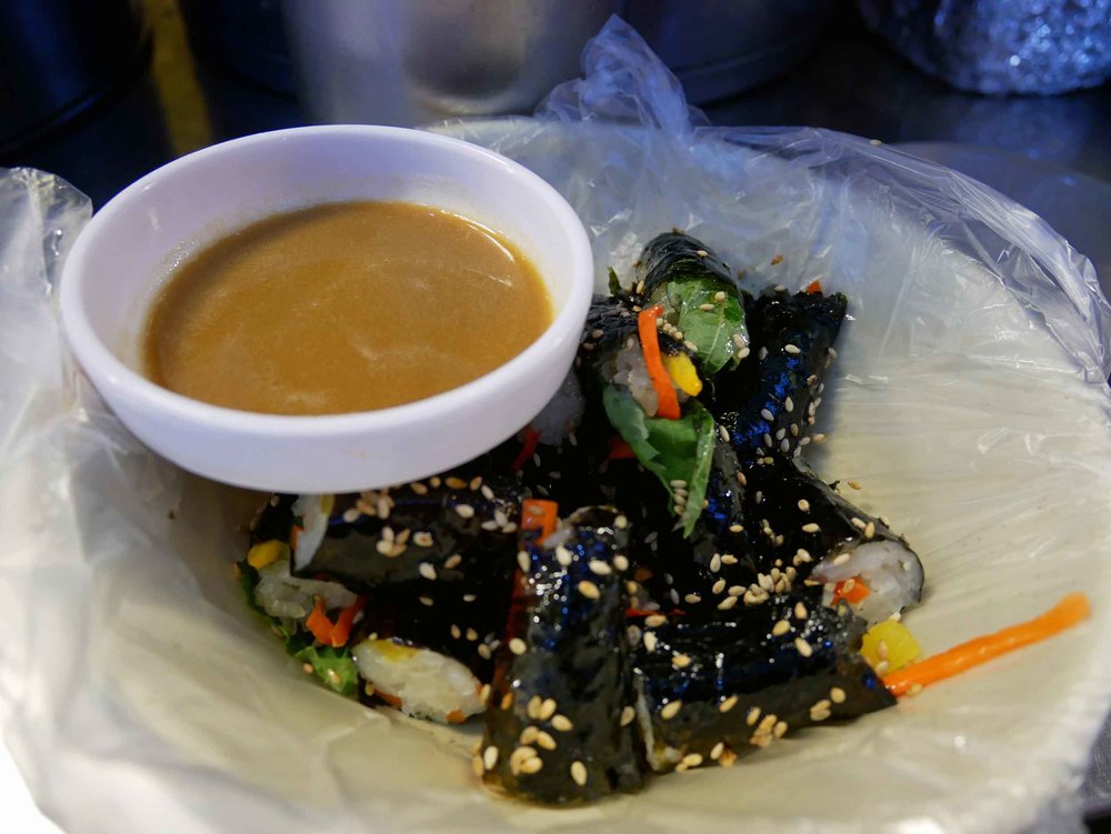  Here, we tried  gimbap , or seaweed rice rolls. 