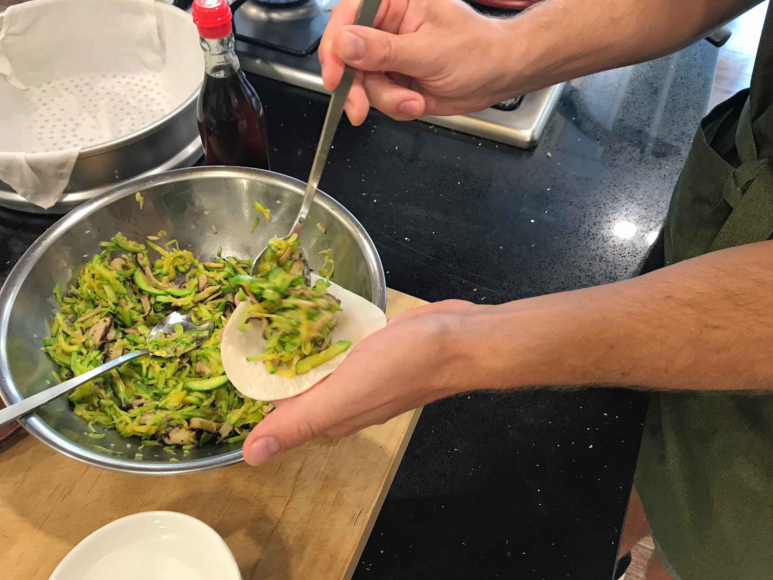  Stuffing our dumplings with a mixture of zuchinni and shitake mushroom.&nbsp; 