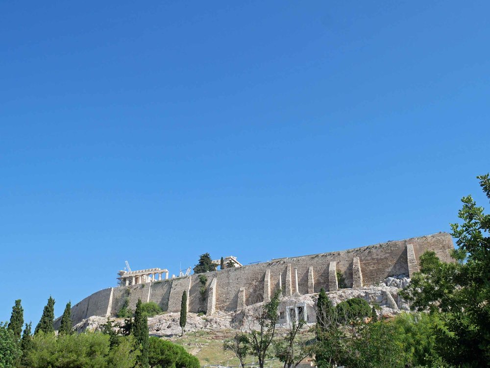  The Acropolis is located on a flat-topped rock that rises 150 m (490 ft) above sea level with a surface area of about 3 hectares (7.4 acres).&nbsp; 