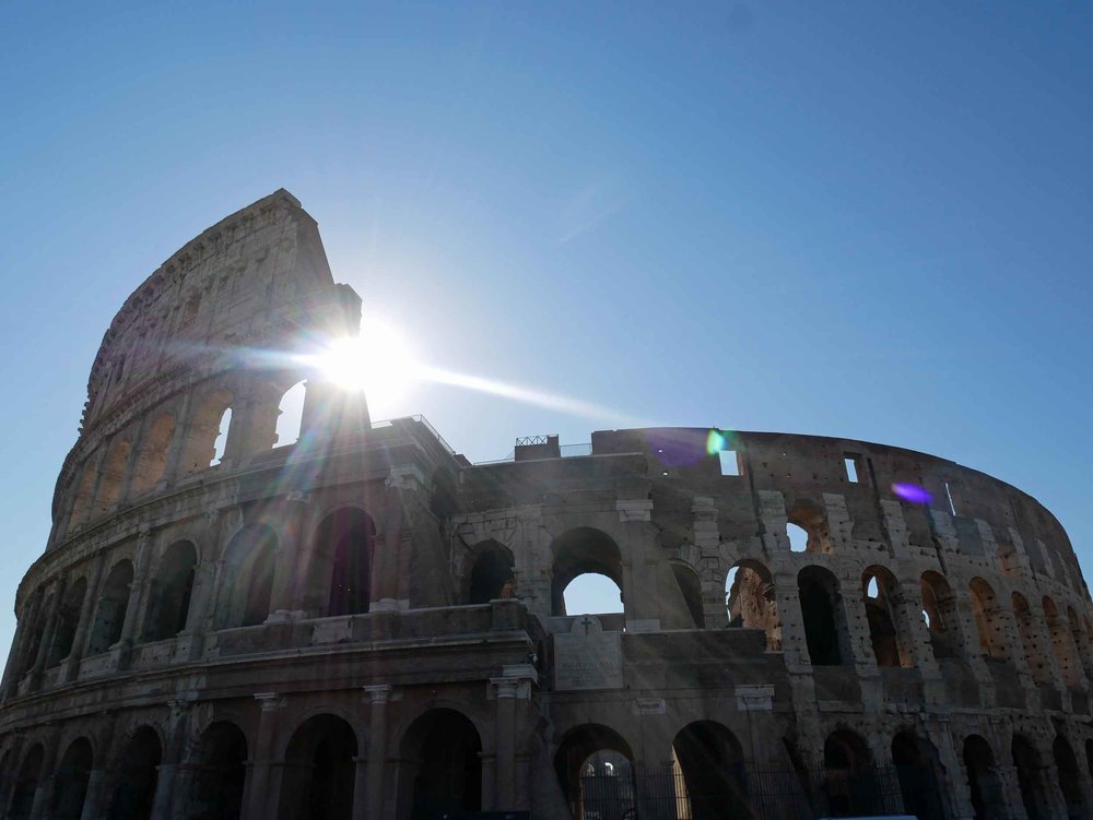  Up early to beat the crowds (and heat), the rising sun was a beautiful backdrop to Rome's ancient Colosseum (July 13).&nbsp; 
