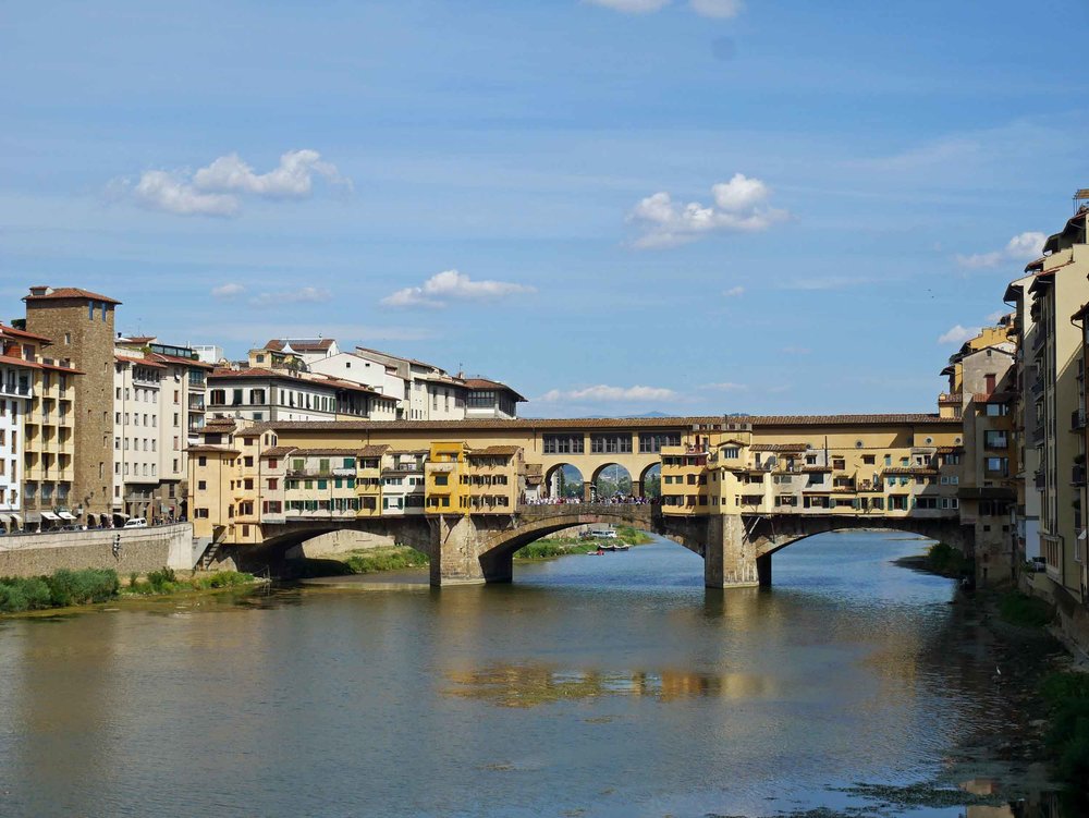  Florence's famous medieval Ponte Vecchio, or "Old Bridge" with shops that dot the arch over the Arno.&nbsp; 